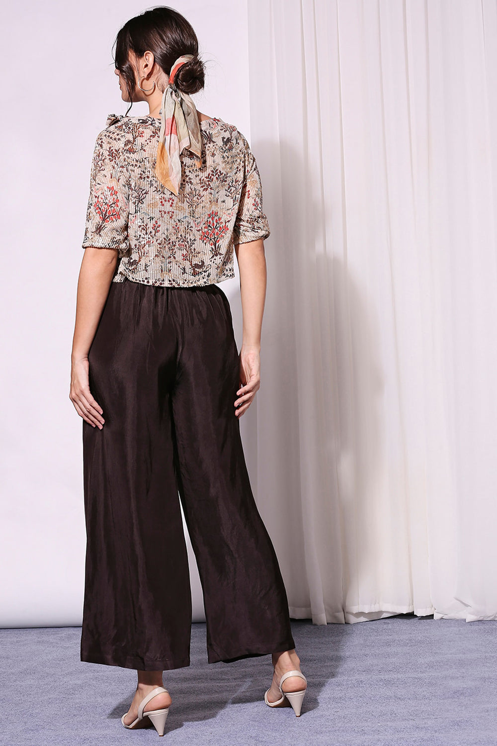 Printed Sequin Off-Shoulder Top Paired With Brown Pants