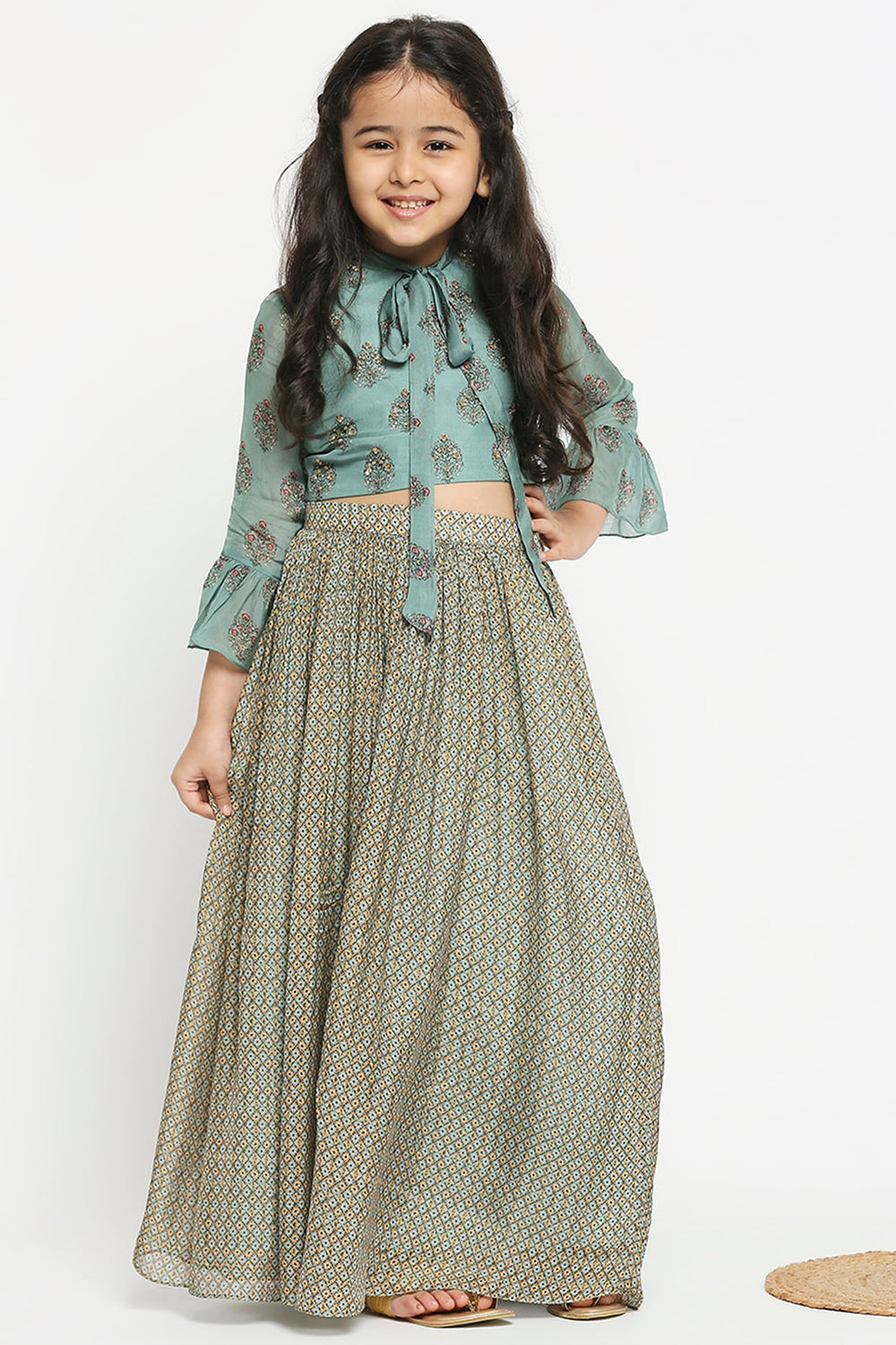 Muasir Printed Skirt Paired With Crop Top Which Has Bell Sleeves And Neck Tie Up
